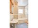 Bathroom with a shower-tub combo, pedestal sink, and floral wallpaper at 610 Hawthorne Ln, Charlotte, NC 28204