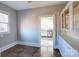 Butler's pantry featuring original, painted cabinets, hardwood floors, and natural light at 610 Hawthorne Ln, Charlotte, NC 28204