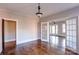 A light filled dining room with hardwood floors, light walls, and multiple entryways at 610 Hawthorne Ln, Charlotte, NC 28204