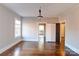 A light filled dining room with hardwood floors, light walls, and multiple entryways at 610 Hawthorne Ln, Charlotte, NC 28204