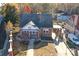 Aerial view of a brick home with a covered carport, showcasing its proximity to surrounding homes and neighborhood at 610 Hawthorne Ln, Charlotte, NC 28204