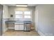 Charming kitchen featuring ample counter space, stainless steel dishwasher and natural light at 610 Hawthorne Ln, Charlotte, NC 28204