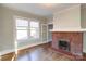 Living room showcasing hardwood floors and a brick fireplace at 610 Hawthorne Ln, Charlotte, NC 28204