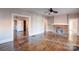 Bright living room featuring hardwood floors, neutral wall color, and a brick fireplace at 610 Hawthorne Ln, Charlotte, NC 28204