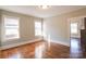 Living room featuring hardwood floors and two windows offering natural light at 610 Hawthorne Ln, Charlotte, NC 28204