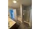 Neutral bathroom featuring a glass shower and soaking tub at 8603 Westhope St, Charlotte, NC 28216