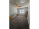 Bedroom featuring an ironing board, dresser, and ceiling fan at 8603 Westhope St, Charlotte, NC 28216