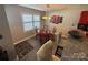 Cozy dining area with modern table set, pendant lighting, and view of kitchen bar seating at 8603 Westhope St, Charlotte, NC 28216