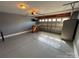 Spacious garage featuring painted floors, gray walls, and overhead lighting at 8603 Westhope St, Charlotte, NC 28216