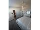 Light-filled main bedroom features coordinated dressers and multiple entry points at 8603 Westhope St, Charlotte, NC 28216