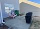 Back patio area with furniture and a covered grill at 8603 Westhope St, Charlotte, NC 28216