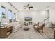 Inviting living room with comfortable seating and large windows providing ample natural light at 8635 Miles Gap Rd, Indian Land, SC 29707