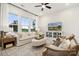 Comfortable living room with views of the outdoors through large windows creating an inviting space at 8635 Miles Gap Rd, Indian Land, SC 29707