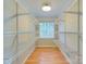 Walk-in closet with custom shelving and a window providing natural light and ventilation at 9607 Kestral Ridge Dr, Charlotte, NC 28269
