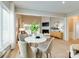 Bright dining area with a round table, stylish chairs, and views to the living room at 9607 Kestral Ridge Dr, Charlotte, NC 28269