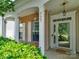 Charming covered front porch with brick facade and white columns at 9607 Kestral Ridge Dr, Charlotte, NC 28269