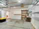 Spacious garage with storage cabinets, shelving, and a workbench at 9607 Kestral Ridge Dr, Charlotte, NC 28269