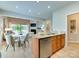 Open-concept kitchen features stainless steel appliances, granite countertops, and a breakfast area at 9607 Kestral Ridge Dr, Charlotte, NC 28269