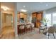 Spacious kitchen with stainless steel appliances, an island with bar seating, and an adjacent dining area at 9607 Kestral Ridge Dr, Charlotte, NC 28269