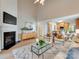 Open-concept living room with a fireplace, connecting to the kitchen and dining areas at 9607 Kestral Ridge Dr, Charlotte, NC 28269