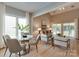 Bright and airy living room featuring large windows, neutral decor, and stylish furnishings at 9607 Kestral Ridge Dr, Charlotte, NC 28269