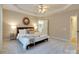 Main bedroom showcasing neutral paint, a ceiling fan, and ensuite bathroom at 9607 Kestral Ridge Dr, Charlotte, NC 28269
