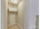 Small room with door and cabinet featuring carpet flooring and neutral paint at 9607 Kestral Ridge Dr, Charlotte, NC 28269