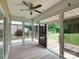 Light-filled sunroom with sliding glass doors leading to the patio and backyard at 9607 Kestral Ridge Dr, Charlotte, NC 28269