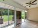 Enclosed sunroom featuring sliding glass doors that open to a patio and backyard views at 9607 Kestral Ridge Dr, Charlotte, NC 28269