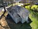 Aerial view of a gray home featuring a dark roof, a yard and an air conditioning unit at 1001 Craven Ave, Kannapolis, NC 28083