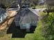 Cozy gray home with a well-maintained roof, small windows, and a quaint backyard with green grass at 1001 Craven Ave, Kannapolis, NC 28083