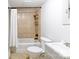 Classic bathroom with tiled shower, white tub, toilet, and vanity sink with chrome fixtures at 1001 Craven Ave, Kannapolis, NC 28083