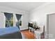 Bright bedroom featuring hardwood floors, a large window with curtains, and a cozy atmosphere at 1001 Craven Ave, Kannapolis, NC 28083