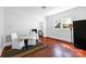 Cozy dining area featuring hardwood floors, a cozy table setup, and natural light streaming through the windows at 1001 Craven Ave, Kannapolis, NC 28083