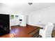 Bright dining area featuring hardwood floors with an archway to the kitchen and windows letting in plenty of sunlight at 1001 Craven Ave, Kannapolis, NC 28083