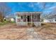 Charming home with a welcoming front porch and beautiful landscaping, great for curb appeal at 1001 Craven Ave, Kannapolis, NC 28083