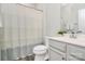 Well-lit bathroom with a combination shower and tub, and a vanity with storage at 1032 Barnette Farm Ln, Monroe, NC 28110