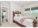 Comfortable bedroom with natural light, a wrought iron headboard, and neutral decor at 1032 Barnette Farm Ln, Monroe, NC 28110