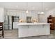 Beautiful kitchen featuring stainless appliances, a large island, pendant lighting, and a stylish backsplash at 1032 Barnette Farm Ln, Monroe, NC 28110