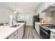 Stylish kitchen featuring stainless appliances, a kitchen island, sleek countertops, and a dining area at 1032 Barnette Farm Ln, Monroe, NC 28110