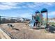 Community playground with colorful play structures, swings, and a bench, offering a fun area for children at 1032 Barnette Farm Ln, Monroe, NC 28110