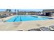 Outdoor community swimming pool surrounded by lounge chairs and deck at 1032 Barnette Farm Ln, Monroe, NC 28110