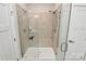 Modern bathroom shower features both rainfall and handheld shower heads, plus a built-in bench at 1032 Barnette Farm Ln, Monroe, NC 28110