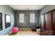 Stylish bedroom with a pink ball, yoga mat and a large wardrobe providing a modern feel at 10547 Skipping Rock Nw Ln, Concord, NC 28027