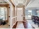 Elegant foyer with hardwood floors, detailed trim, and views into the dining room at 10547 Skipping Rock Nw Ln, Concord, NC 28027