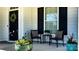 Cozy front porch featuring comfortable seating and decorative planters, perfect for relaxing at 10547 Skipping Rock Nw Ln, Concord, NC 28027