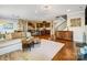 Spacious home featuring hardwood floors in the living room, dining area, and staircase at 10547 Skipping Rock Nw Ln, Concord, NC 28027