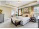 Beautiful main bedroom with tray ceiling, calming neutral paint and access to the ensuite bathroom at 10547 Skipping Rock Nw Ln, Concord, NC 28027