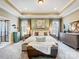Spacious main bedroom with a tray ceiling, neutral paint, and a cozy sitting area with lush carpet at 10547 Skipping Rock Nw Ln, Concord, NC 28027