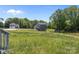 View of new home with a spacious yard and large trees at 106 Desert Sky Ct, Statesville, NC 28625
